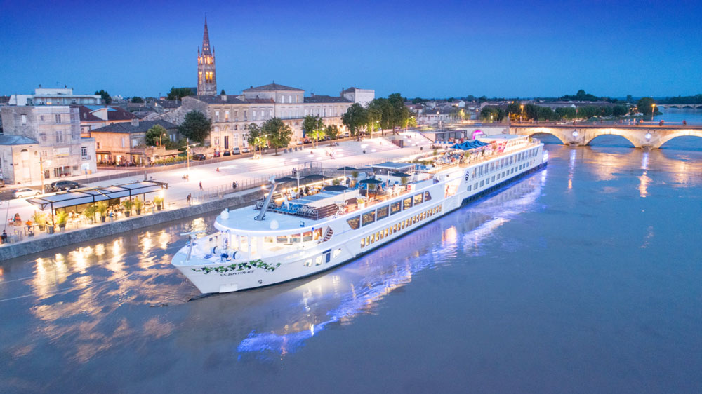 River cruise ship at night - Libourne, France